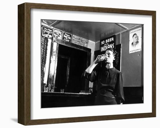 Woman Drinking under Sign, No Beer Sold to Indians, Katherine's Place, Happy Hollow, Fort Peck Dam-Margaret Bourke-White-Framed Photographic Print