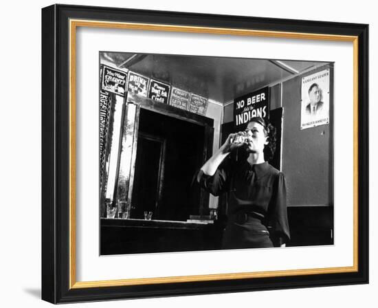 Woman Drinking under Sign, No Beer Sold to Indians, Katherine's Place, Happy Hollow, Fort Peck Dam-Margaret Bourke-White-Framed Photographic Print