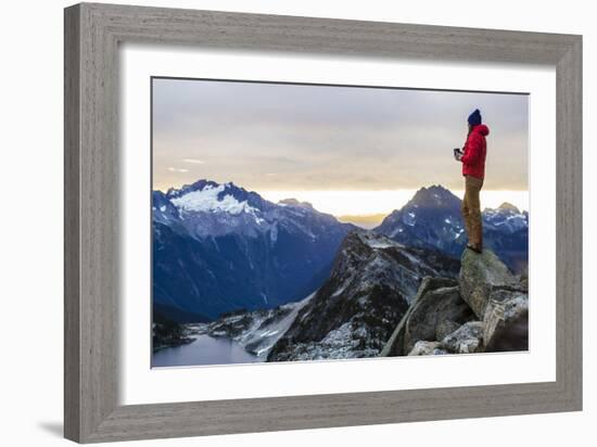 Woman Drinks Her Coffee On Top Of A Mountain In The Morning Looking Out Into The Cascade Mts In WA-Hannah Dewey-Framed Photographic Print