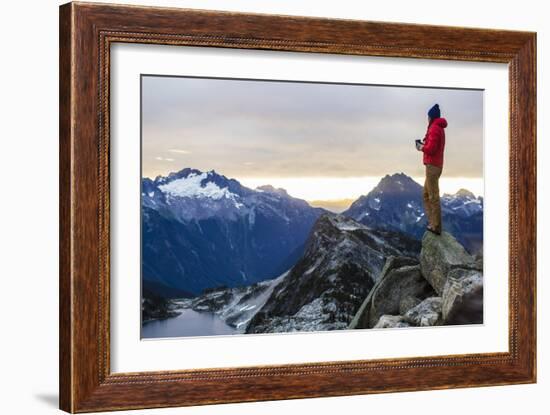 Woman Drinks Her Coffee On Top Of A Mountain In The Morning Looking Out Into The Cascade Mts In WA-Hannah Dewey-Framed Photographic Print