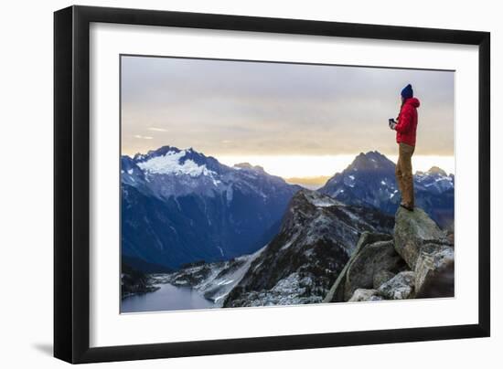 Woman Drinks Her Coffee On Top Of A Mountain In The Morning Looking Out Into The Cascade Mts In WA-Hannah Dewey-Framed Photographic Print