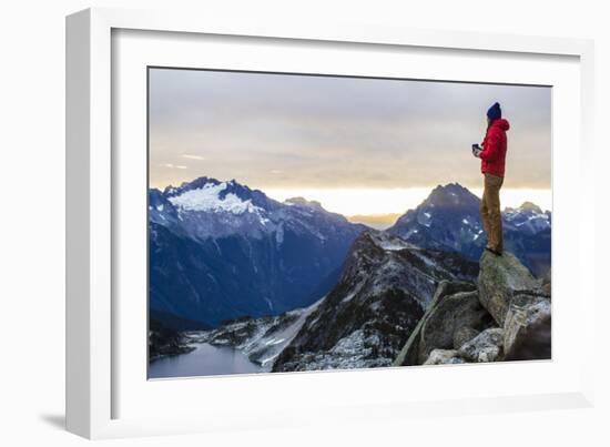 Woman Drinks Her Coffee On Top Of A Mountain In The Morning Looking Out Into The Cascade Mts In WA-Hannah Dewey-Framed Photographic Print