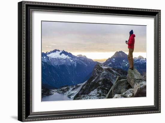 Woman Drinks Her Coffee On Top Of A Mountain In The Morning Looking Out Into The Cascade Mts In WA-Hannah Dewey-Framed Photographic Print