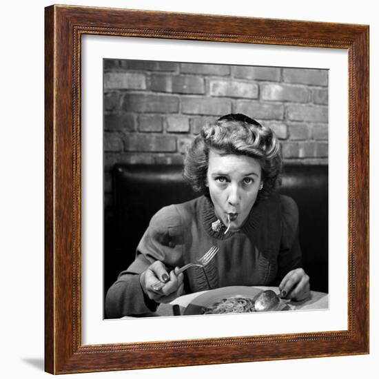 Woman Eating Spaghetti in Restaurant. No.5 of Sequence of 6-Alfred Eisenstaedt-Framed Photographic Print