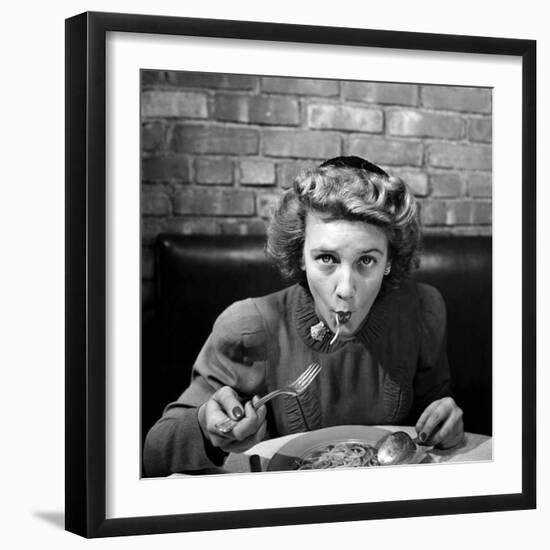 Woman Eating Spaghetti in Restaurant. No.5 of Sequence of 6-Alfred Eisenstaedt-Framed Photographic Print