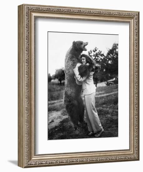 Woman Embraces a Stuffed Bear, Ca. 1940-null-Framed Premium Photographic Print
