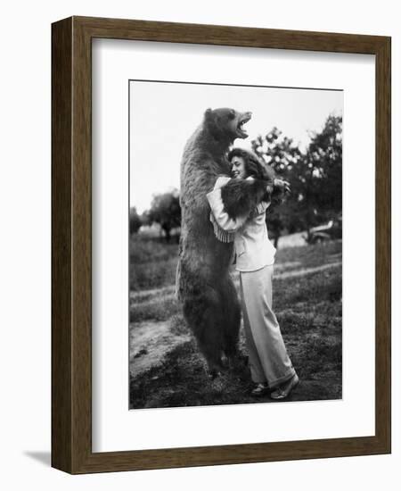 Woman Embraces a Stuffed Bear, Ca. 1940-null-Framed Premium Photographic Print