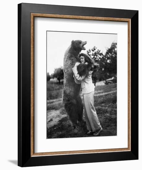 Woman Embraces a Stuffed Bear, Ca. 1940-null-Framed Premium Photographic Print