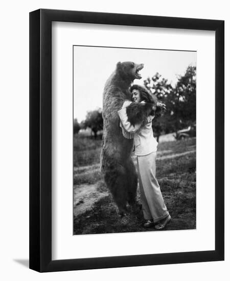 Woman Embraces a Stuffed Bear, Ca. 1940-null-Framed Premium Photographic Print