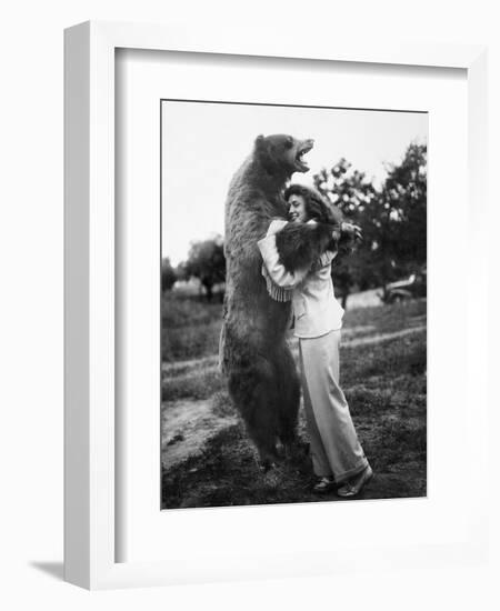 Woman Embraces a Stuffed Bear, Ca. 1940-null-Framed Premium Photographic Print