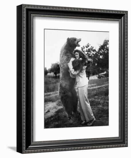 Woman Embraces a Stuffed Bear, Ca. 1940-null-Framed Premium Photographic Print