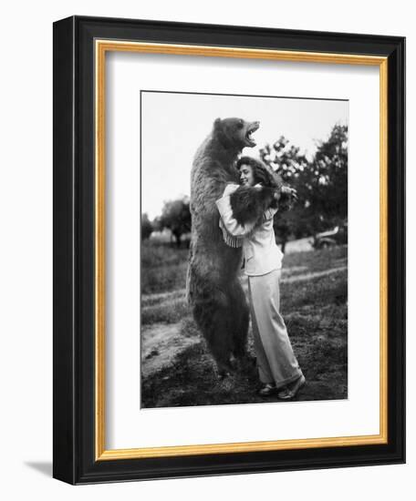 Woman Embraces a Stuffed Bear, Ca. 1940-null-Framed Premium Photographic Print