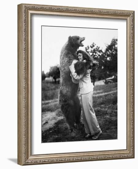 Woman Embraces a Stuffed Bear, Ca. 1940-null-Framed Photographic Print