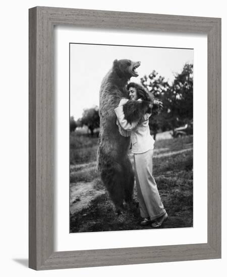 Woman Embraces a Stuffed Bear, Ca. 1940-null-Framed Photographic Print