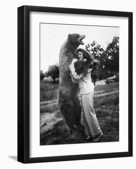 Woman Embraces a Stuffed Bear, Ca. 1940-null-Framed Photographic Print