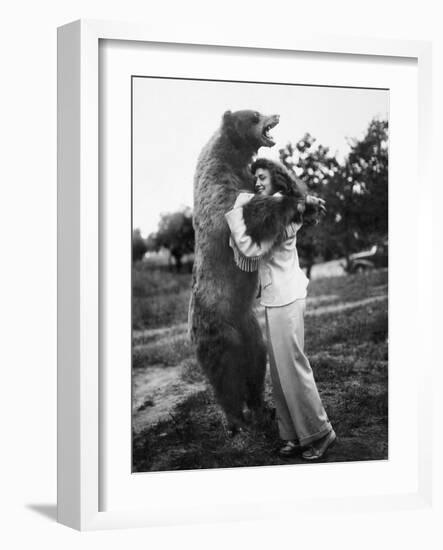 Woman Embraces a Stuffed Bear, Ca. 1940-null-Framed Photographic Print