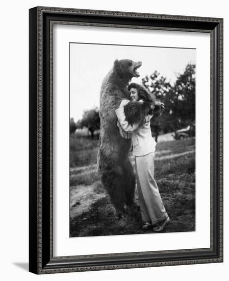 Woman Embraces a Stuffed Bear, Ca. 1940-null-Framed Photographic Print