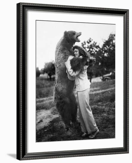 Woman Embraces a Stuffed Bear, Ca. 1940-null-Framed Photographic Print