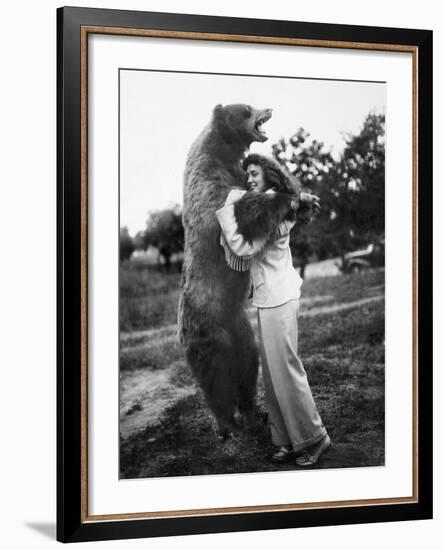 Woman Embraces a Stuffed Bear, Ca. 1940-null-Framed Photographic Print