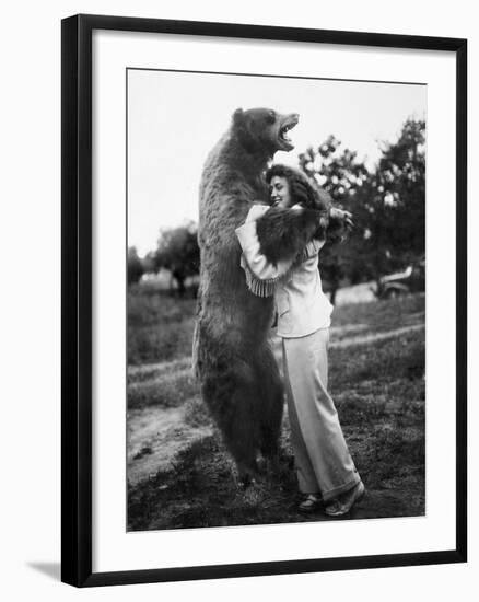 Woman Embraces a Stuffed Bear, Ca. 1940-null-Framed Photographic Print