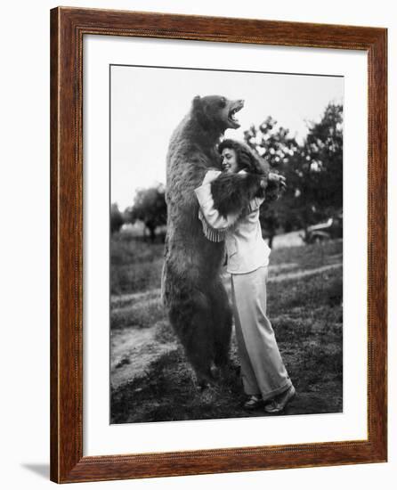 Woman Embraces a Stuffed Bear, Ca. 1940-null-Framed Photographic Print