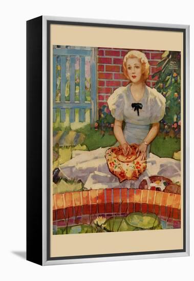 Woman Embroiders By The Side of a Home Pond-null-Framed Stretched Canvas