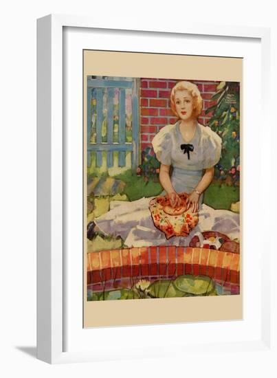 Woman Embroiders By The Side of a Home Pond-null-Framed Art Print