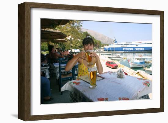 Woman Enjoying a Drink in a Harbourside Taverna, Poros, Kefalonia, Greece-Peter Thompson-Framed Photographic Print