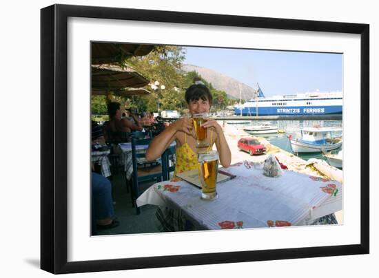 Woman Enjoying a Drink in a Harbourside Taverna, Poros, Kefalonia, Greece-Peter Thompson-Framed Photographic Print