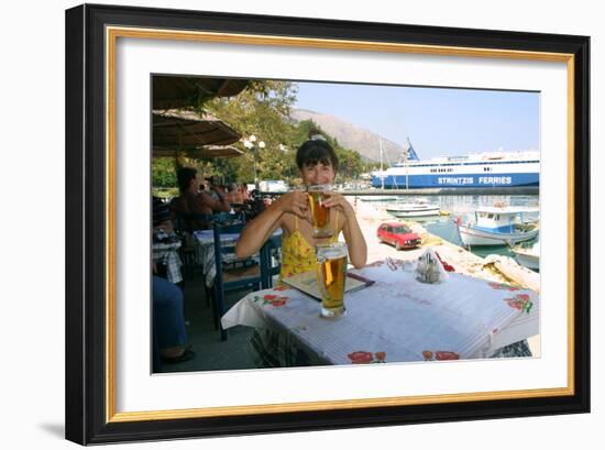 Woman Enjoying a Drink in a Harbourside Taverna, Poros, Kefalonia, Greece-Peter Thompson-Framed Photographic Print