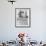 Woman Enjoying a Game of Shuffleboard-null-Framed Photo displayed on a wall