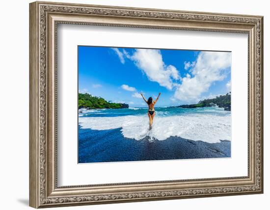 Woman enjoying the sun on one of Maui's black sand beaches, Maui, Hawaii-Laura Grier-Framed Photographic Print