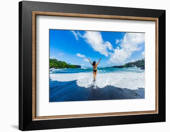 Woman enjoying the sun on one of Maui's black sand beaches, Maui, Hawaii-Laura Grier-Framed Photographic Print