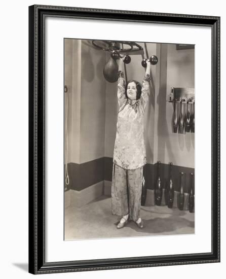 Woman Exercising in Silk Pajamas-null-Framed Photo