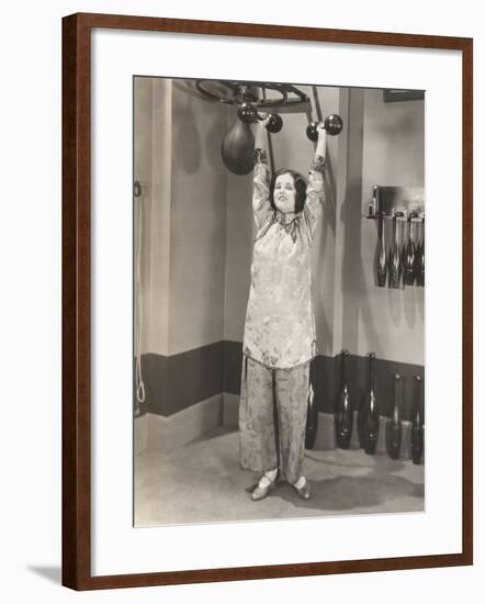 Woman Exercising in Silk Pajamas-null-Framed Photo