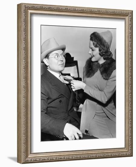 Woman Fixing Mans Tie-null-Framed Photo