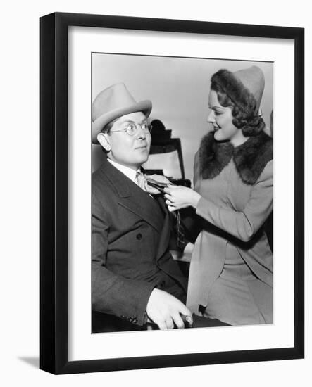 Woman Fixing Mans Tie-null-Framed Photo