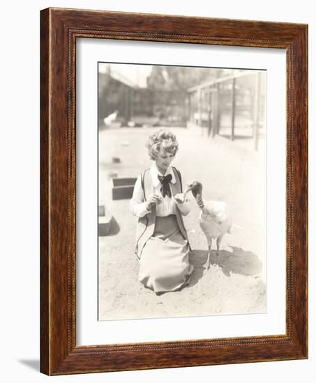 Woman Hand Feeding Turkey-null-Framed Photo