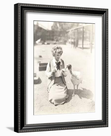 Woman Hand Feeding Turkey-null-Framed Photo