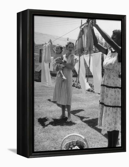 Woman Hanging the Laundry Out to Dry-Nina Leen-Framed Premier Image Canvas