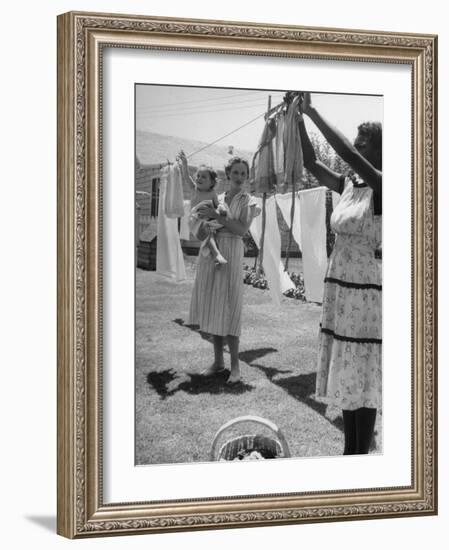 Woman Hanging the Laundry Out to Dry-Nina Leen-Framed Photographic Print