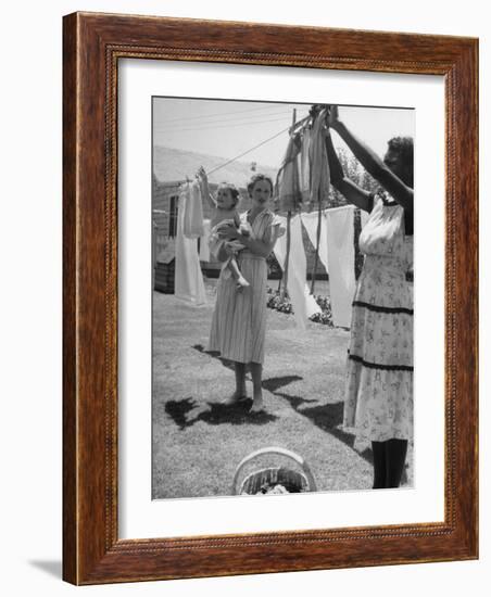 Woman Hanging the Laundry Out to Dry-Nina Leen-Framed Photographic Print