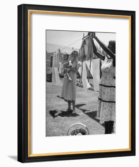 Woman Hanging the Laundry Out to Dry-Nina Leen-Framed Photographic Print