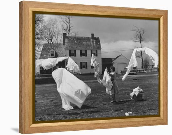 Woman Hanging Up the Laundry on the Line-Ed Clark-Framed Premier Image Canvas