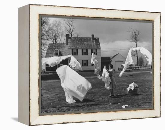 Woman Hanging Up the Laundry on the Line-Ed Clark-Framed Premier Image Canvas