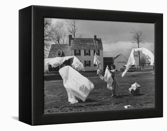 Woman Hanging Up the Laundry on the Line-Ed Clark-Framed Premier Image Canvas