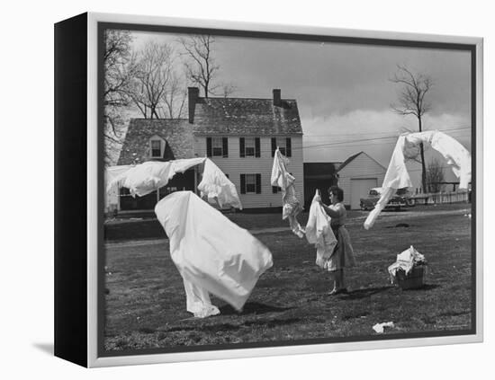 Woman Hanging Up the Laundry on the Line-Ed Clark-Framed Premier Image Canvas