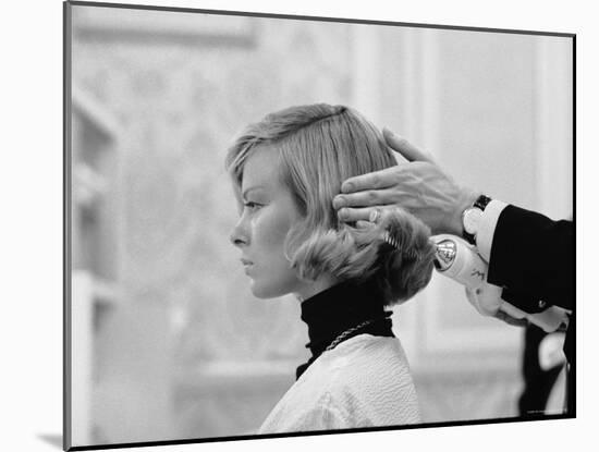 Woman Having Her Hair Styled at Hair Salon at Saks Fifth Avenue-Yale Joel-Mounted Photographic Print
