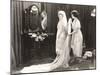 Woman Helping Bride Get Dressed-null-Mounted Photo