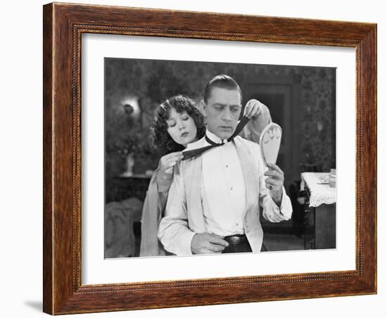 Woman Helping Man Tie Bow Tie-null-Framed Photo